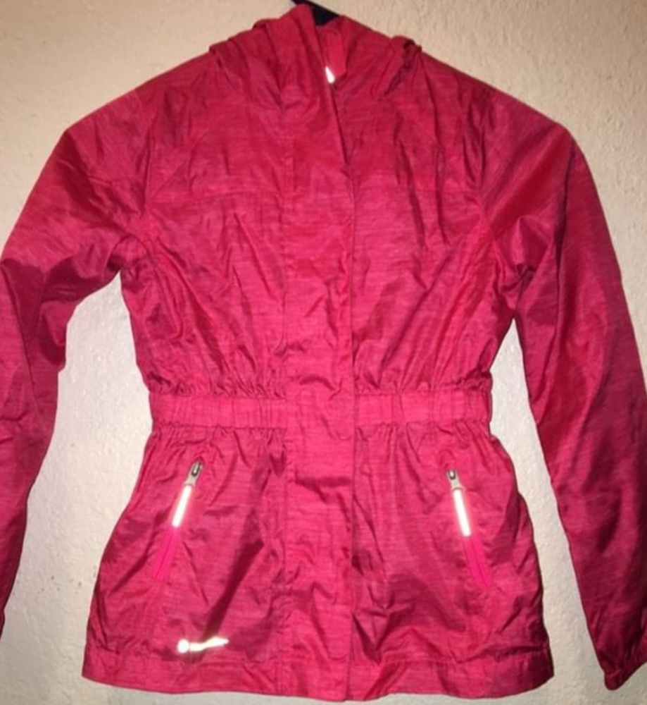 Lightly used pink champion rain jacket